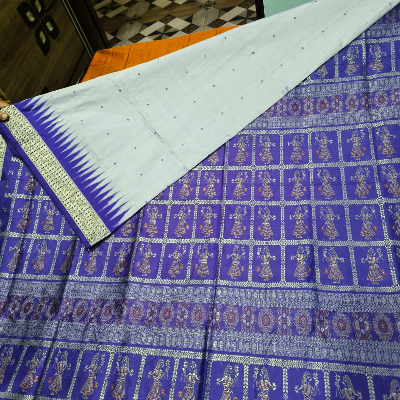 Grey and blue Sonepur handloom saree with buti design on the body and royal bride pattern on the bomkei pallu.