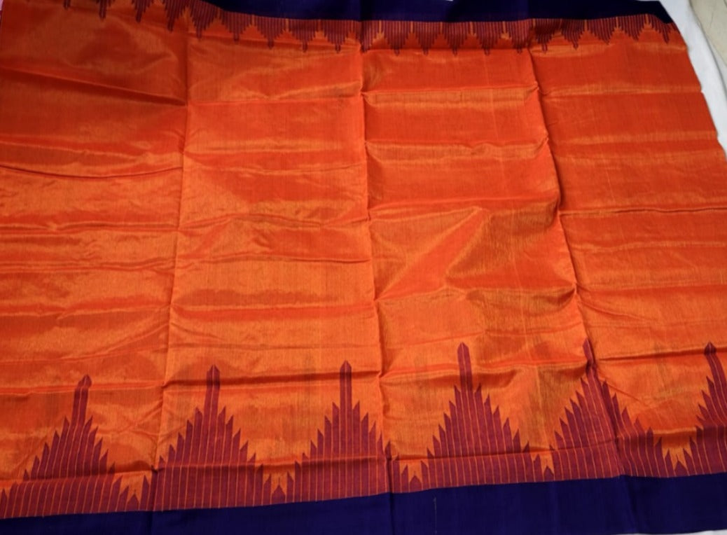 Orange and blue tissue cotton saree with a plain body design, traditional temple border, and lined pallu, exuding elegance and cultural charm.